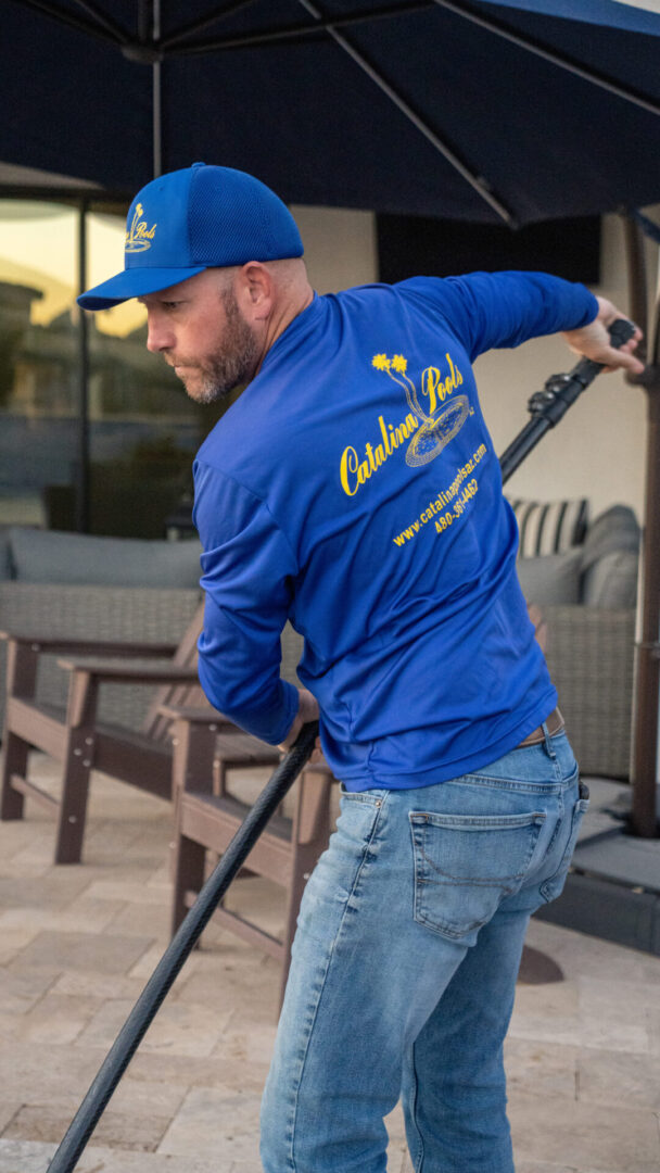 Michael Polak cleaning a swimming pool in the early days of Catalina Pools AZ